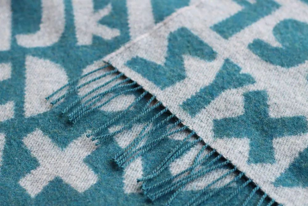 Shop Alphabet Lambswool Throw - Blue Blankets + Throws